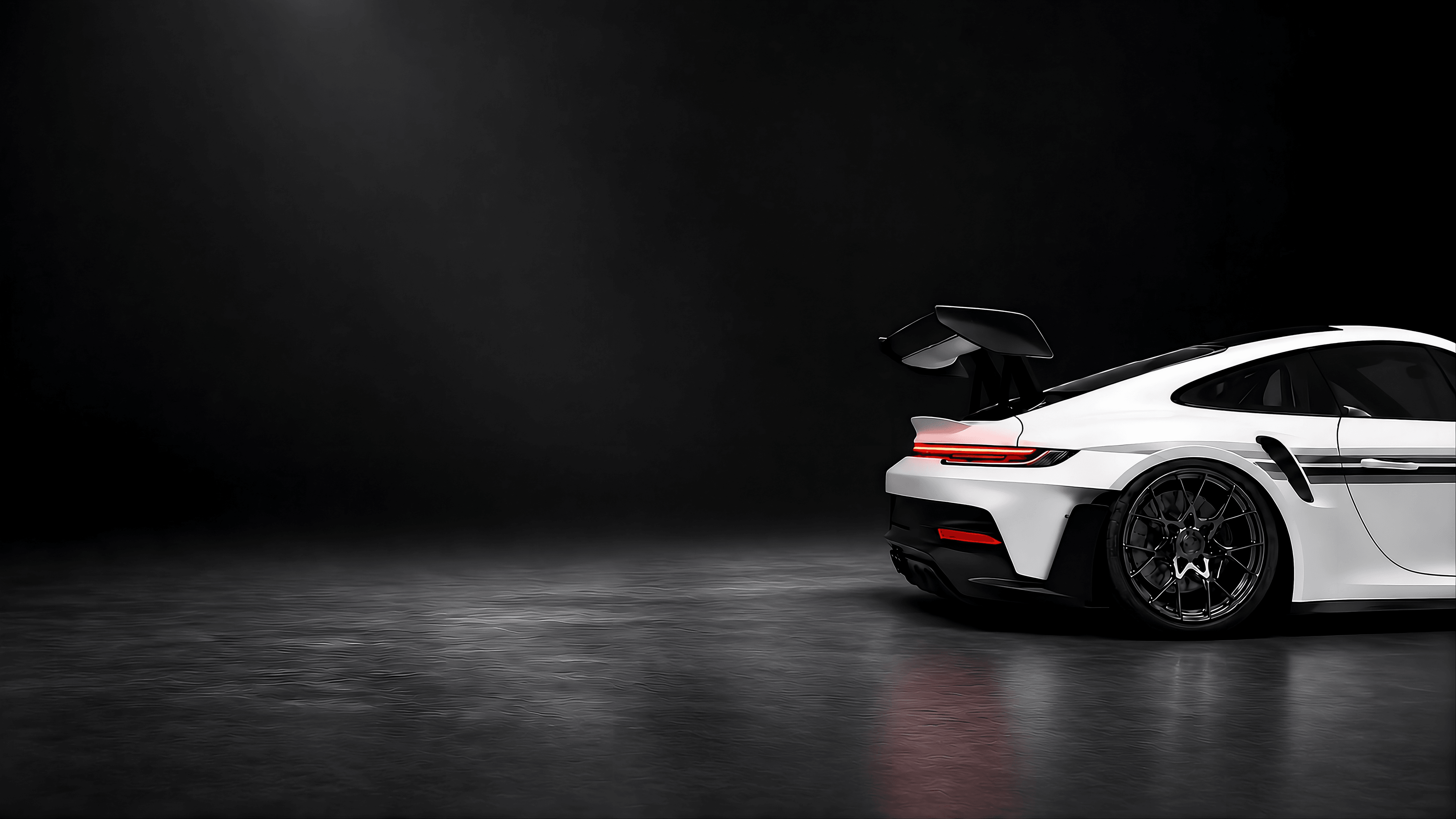 Porsche alb văzut din lateral și din spate, într-un studio întunecat.